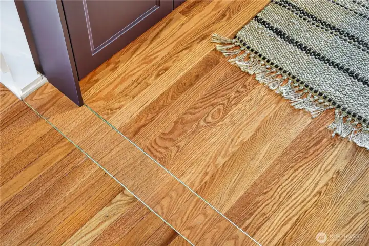 Gold inlay blends the hardwoods from room to room.