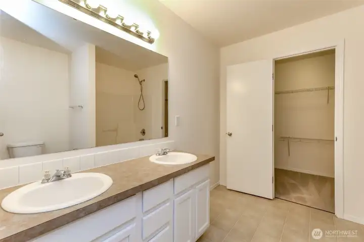 5 piece primary bathroom features soaking tub, shower & double sinks
