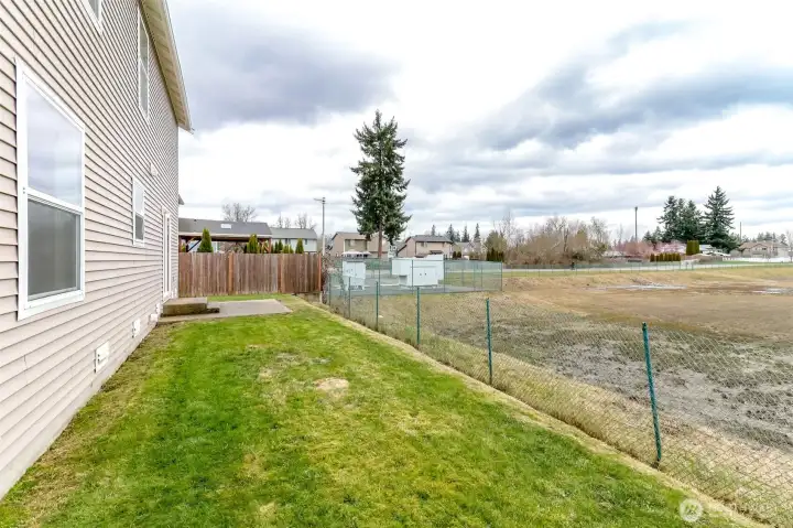 Fully fenced low maintenance yard with patio