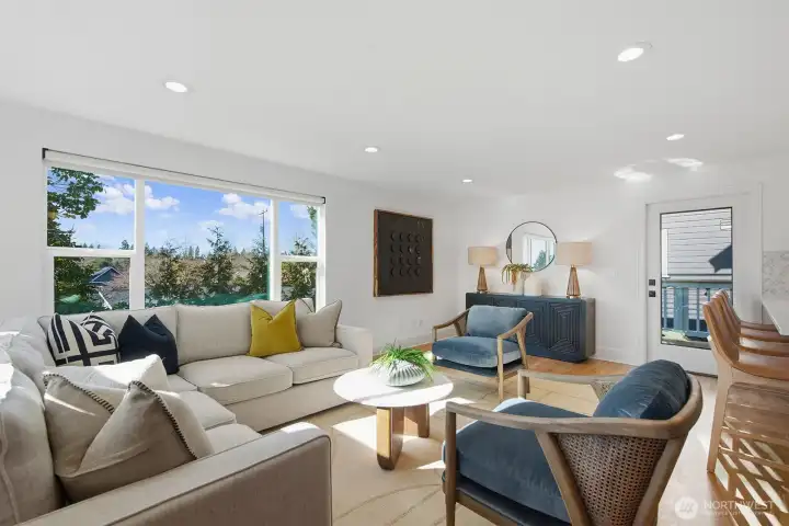 Sun drenched living room right off the kitchen and dining areas.