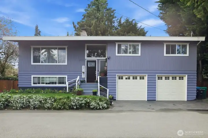 An extra large 2 car garage with 2 parking spots In the driveway with plenty of guest parking for guests