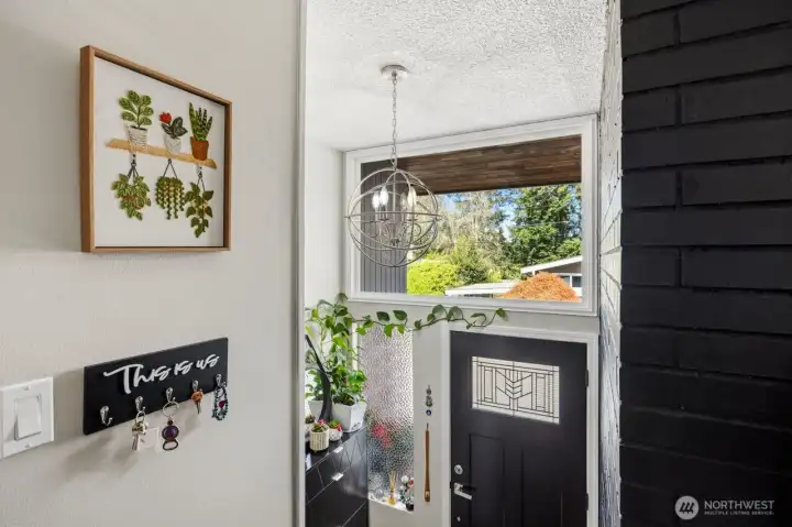 A large entry window welcomes light to the living space