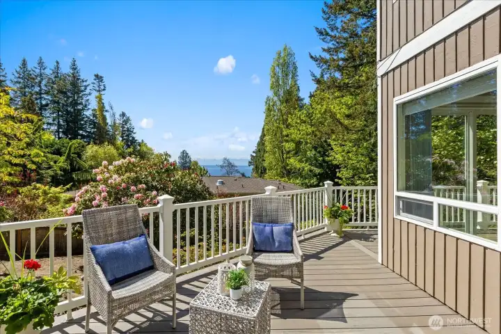 Step out onto the expansive, trex deck to take in the stunning panoramic views of the surrounding greenery, Olympic mounts, & Puget Sound.
