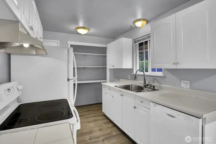 Galley style kitchen with lots of storage.