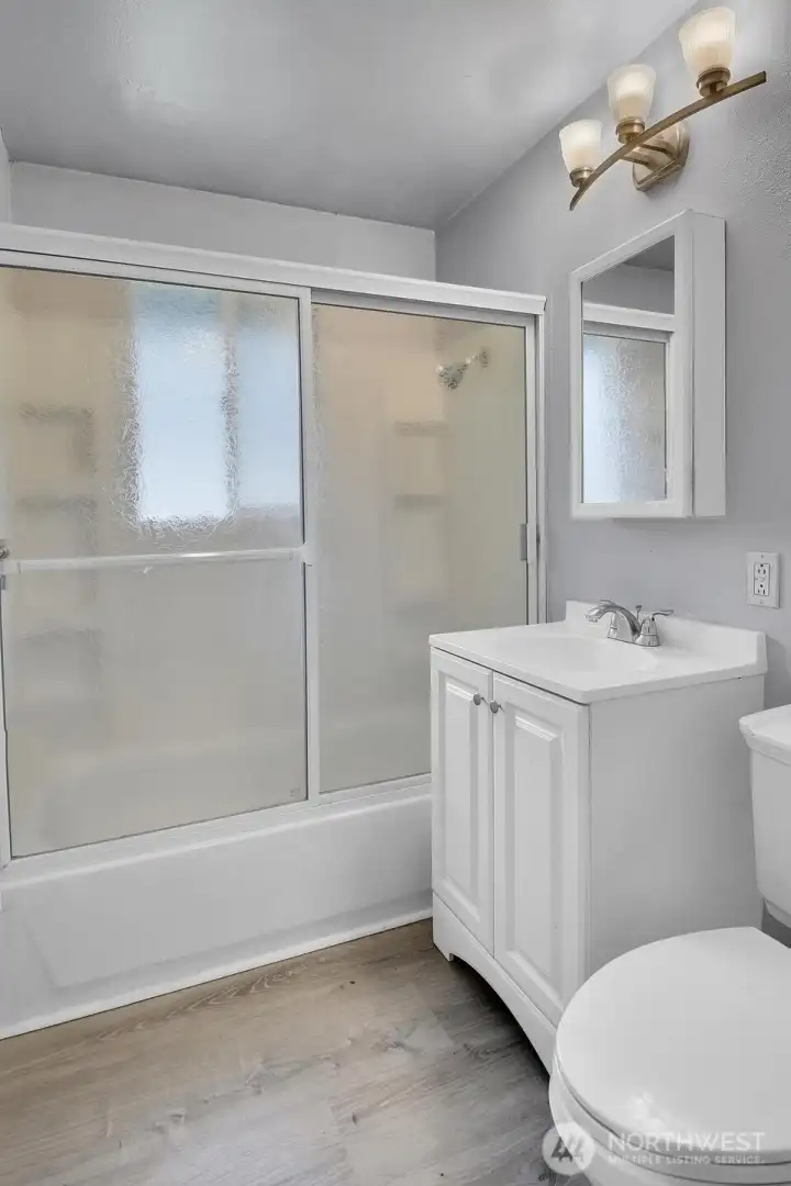 Full bath serves the three additional bedrooms.