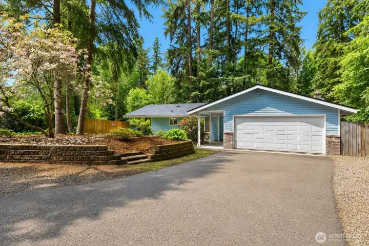 Welcome home to your private rambler on over sized lot surrounded by greenery!