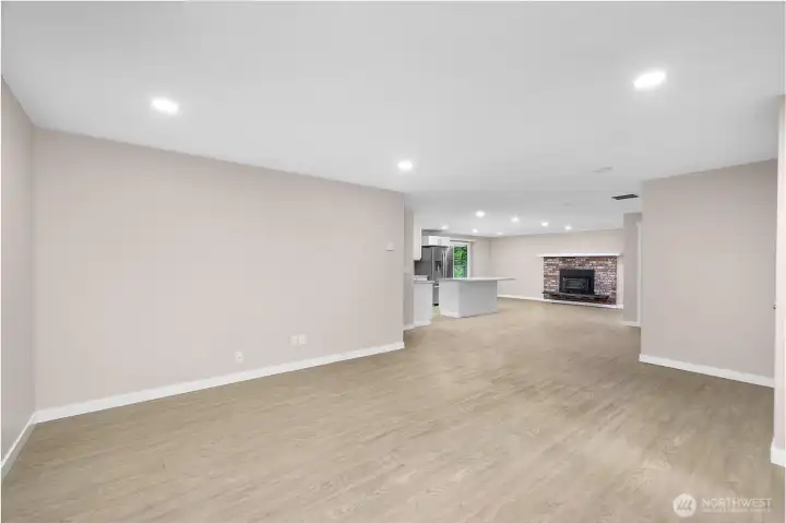 Alternate angle of front living space de-staged. This space has great flow to the kitchen/dining space and second living space.