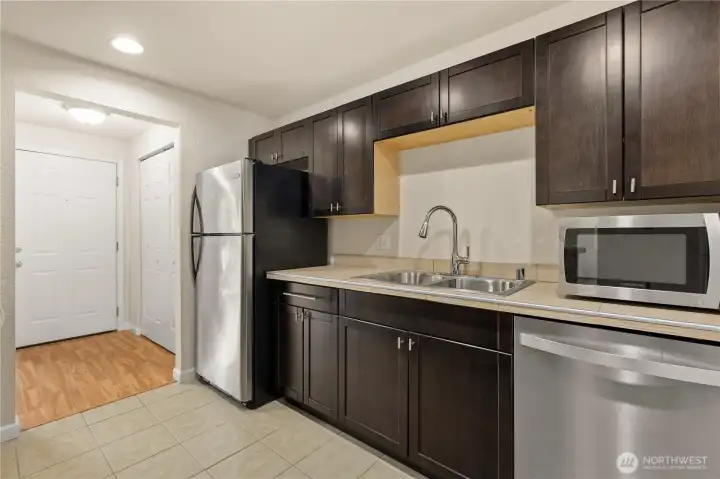 Kitchen has stainless steel appliances.
