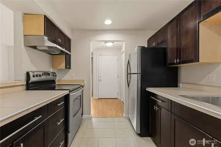 Galley kitchen looking towards the front door.