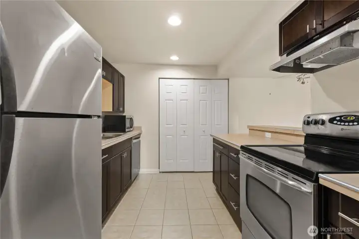 Looking down the galley kitchen towards the laundry / water heater closet.