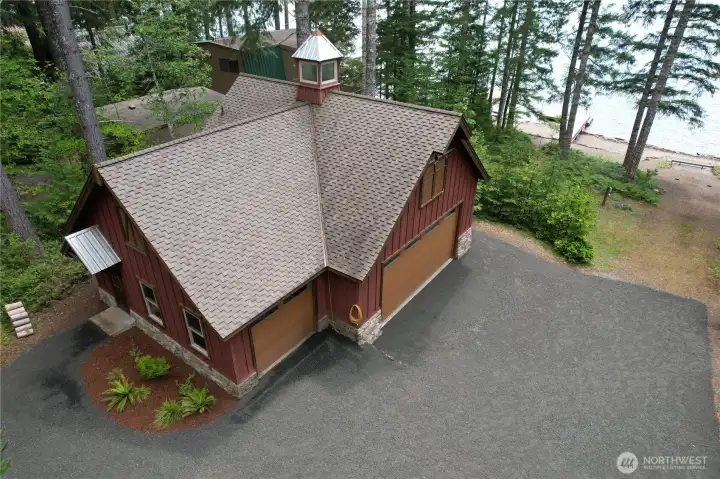 Stunning low-bank waterfront property at beautiful Lake Cushman in desirable Mt. Rose Village.