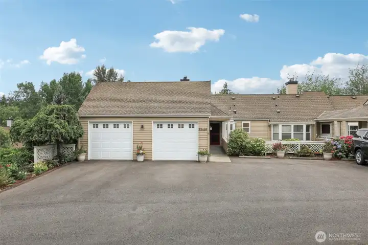 BIG driveway. TWO car garage. Corner upper condo!