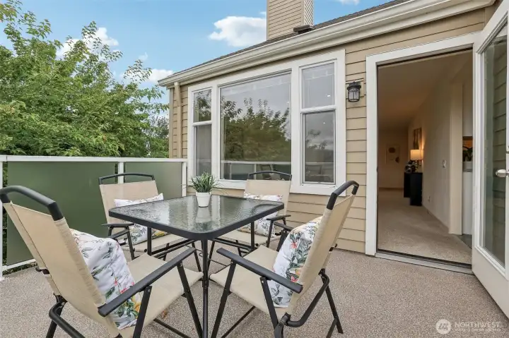 Deck is quite large and could easily fit an umbrella and a couple more chairs.