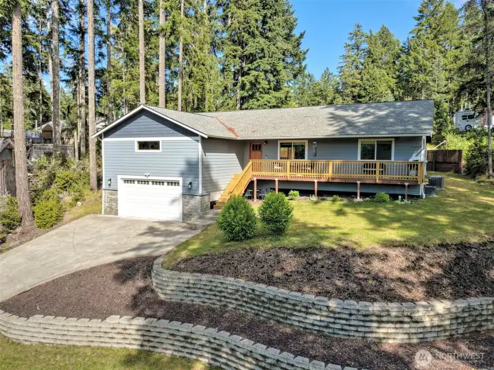 Nestled on a hill overlooking the tiered yard. Nestled on a hill overlooking the tiered yard.