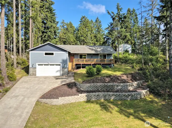 Nestled on a hill overlooking the tiered yard. Nestled on a hill overlooking the tiered yard.