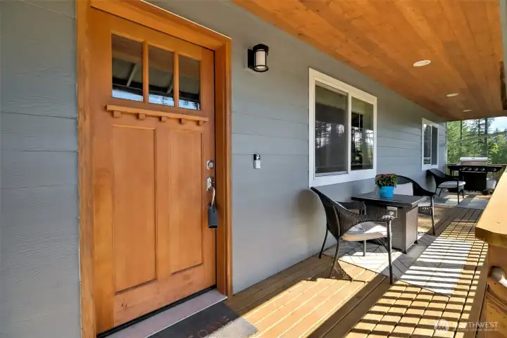 Shaker style door and covered front porch brings a little bit of country to the home. Shaker style door and covered front porch brings a little bit of country to the home.