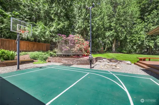 Truly.... a park like setting. Fully fenced, complete with sports court, new trampoline, built in Fire pit with seating, zip line, slide and Ninja equipment. 1.1 acres.