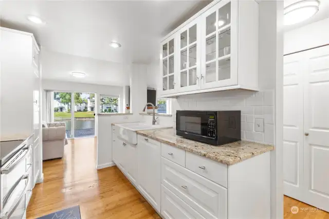 CHECK OUT THIS AMAZING VIEW OF LOW BANK WATERFRONT FROM YOUR STYLISH KITCHEN LOADED WITH LOTS OF LIGHT.  CHECK OUT THE GLASS FILLED CABINETS TO ADD STYLE TO THIS BEAUTIFUL KITCHEN.  SO SO MUCH STYLE TO MAKE YOU HAPPY HERE