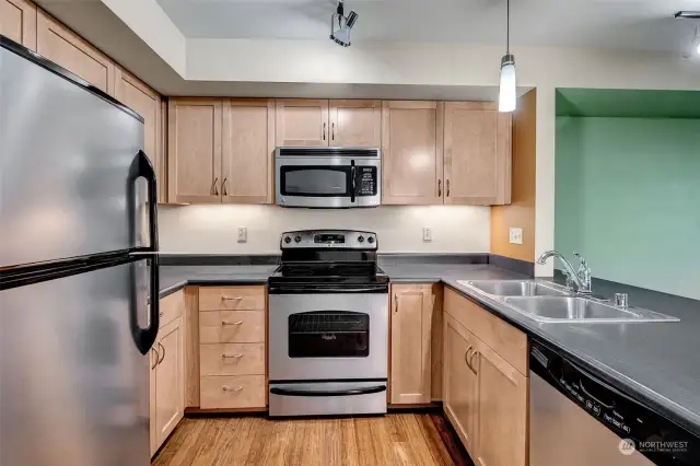 The kitchen features stainless steel appliances and a practical layout for all your meal prep needs.