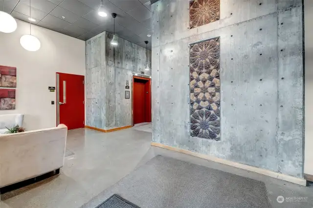 Modern architecture with cement walls and bright red accent colors will impress even the pickiest buyer.