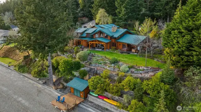 Welcome home to Gig Harbor's "Gold Coast", one of the most coveted waterfront in the area, with sunny southern exposure, miles of walking the beach AND an exquisite custom-built timber frame home on a private wooded acre.  There is another acre lot above this parcel that will be available for purchase, to the buyer of this home.