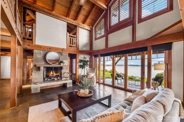 Radiant in-floor heat throughout the main floor, vaulted ceilings, Montana sandstone wood-burning fireplace for cozy evenings, and a light airy feel makes this great room special.