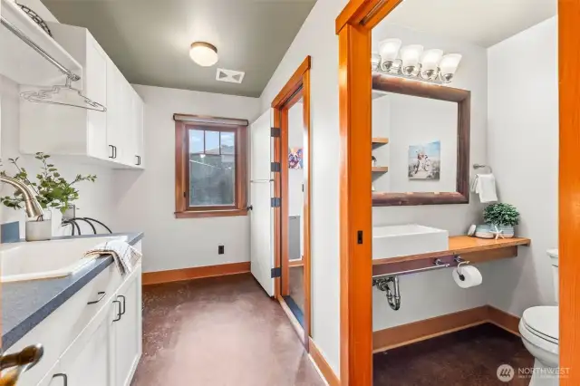 The laundry room with utility sink - through the double door is another room, which you'll see in the next photo.  To the right is a bathroom with a shower.