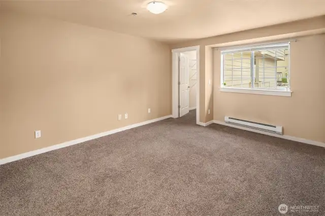 Large bedroom across from laundry
