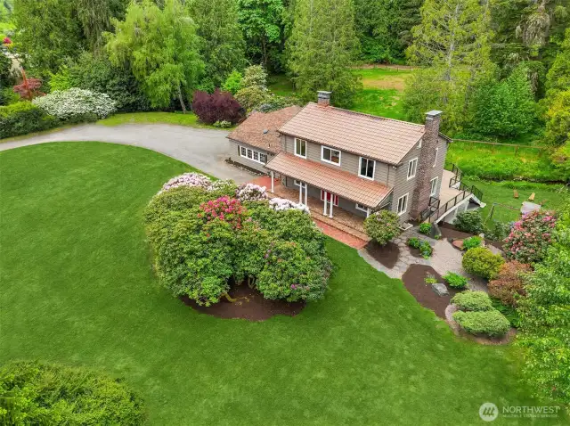 Rich with vintage charm yet designed for modern, multigenerational living. Private creekside sanctuary.