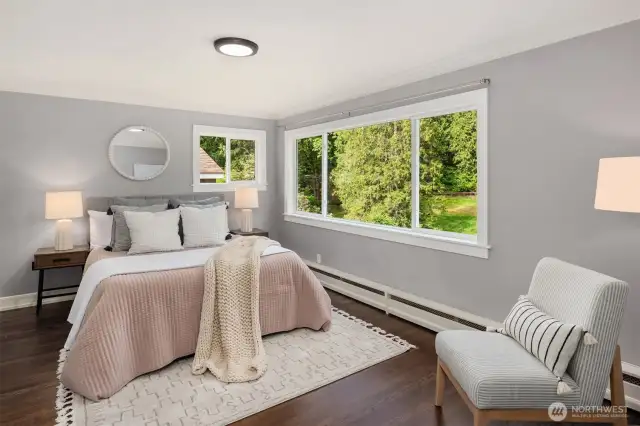 Upper-level guest suite with walk-in closet, western views, and beautiful natural light.
