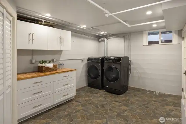 Lower level laundry room with ample area.