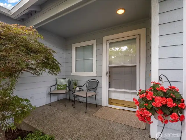 This cozy front porch is welcoming and a nice spot for a morning coffee break.