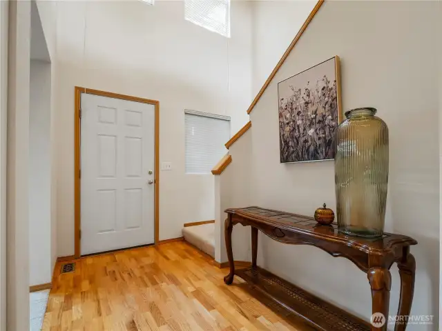 In the main entry, you'll find the bonus room, the stairs leading to the second floor, and the hallway to the main living space.