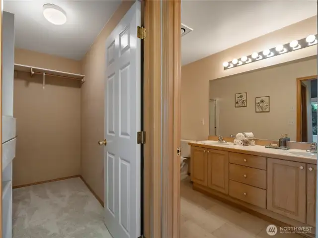 The primary bathroom has large double sinks and lots of space.