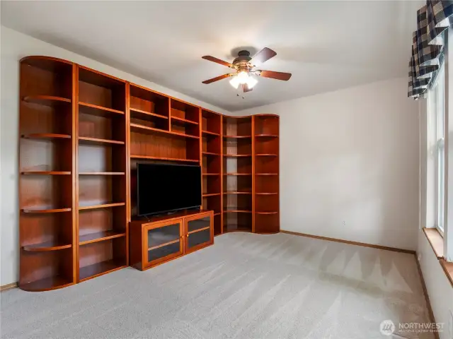 The bonus room is in the front of this home and can be used as an office, family room, or an additional bedroom. *These bookshelves can be easily removed.