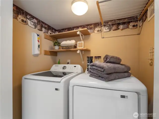In the hallway off the garage and half bath, you'll find the laundry area.
