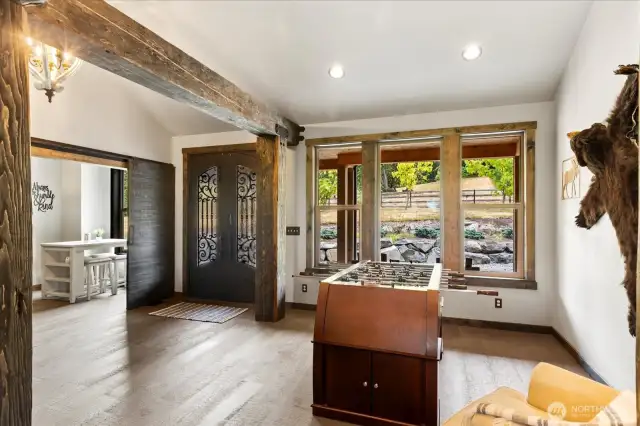 Secure steel front door and the parlor and den off of the entry.