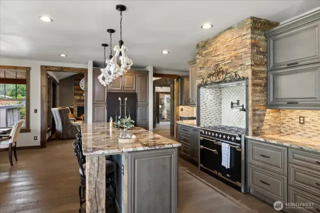 Kitchen with Aga range, pot filler and custom tile.