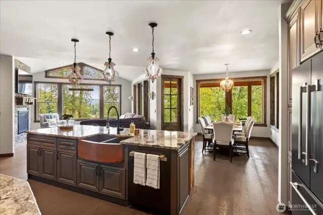 Extra large island with copper sink and bar seating. Open to great room space!