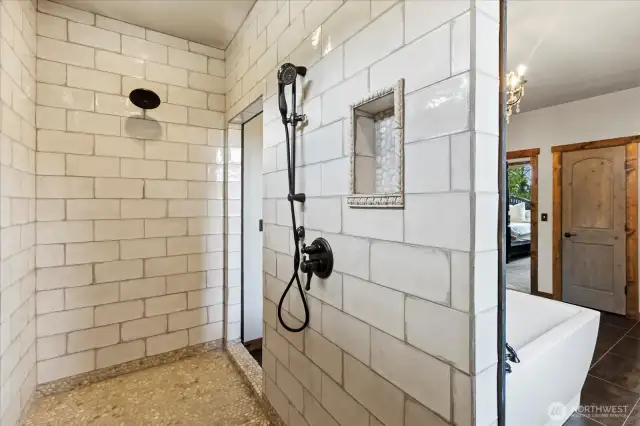 XL walk in shower with dual shower heads.