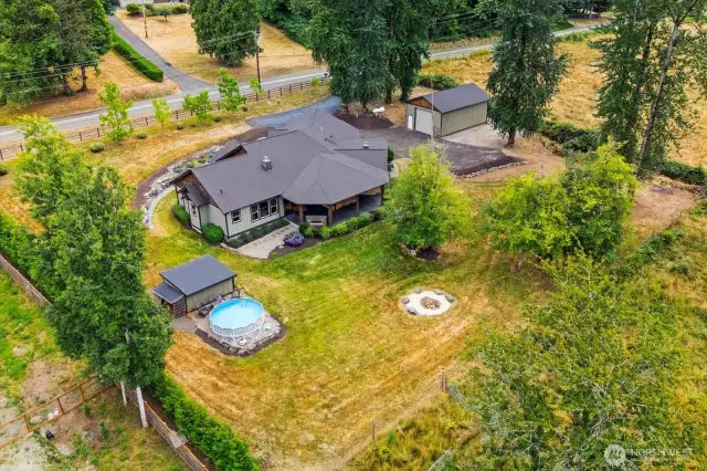 Above ground pool and fire pit, plus lots of room for play, animals or a garden.