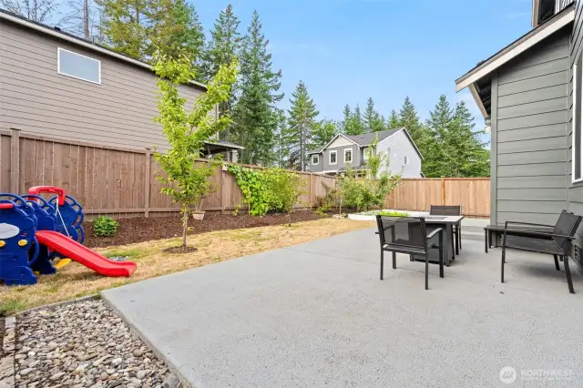 Cement patio is perfect for family gatherings and entertaining, offering a durable and stylish space to enjoy outdoor meals and relax with loved ones.