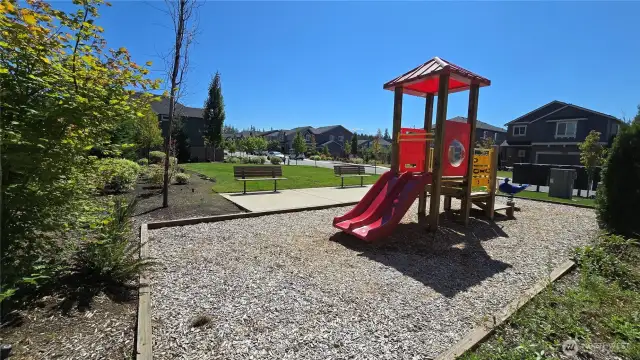 Enjoy charming neighborhood park with open green space, benches, and a fun play structure for kids just a few doors down.