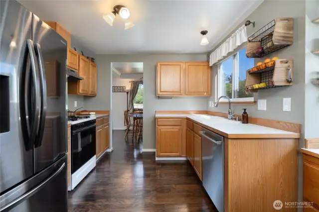 Kitchen has easy access from, entryway, dinning area and garage.
