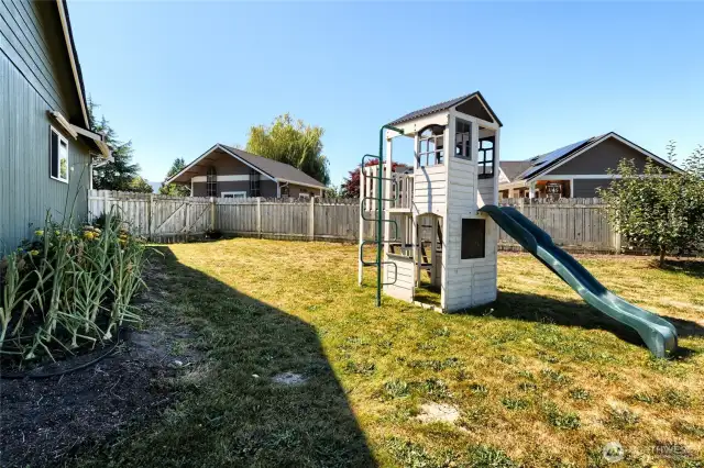 The fenced back yard offers plenty of room to play and enjoy year round.