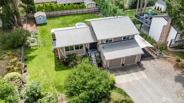 Plenty of parking in the driveway, 2 car-garage, and large space to the right of the driveway.