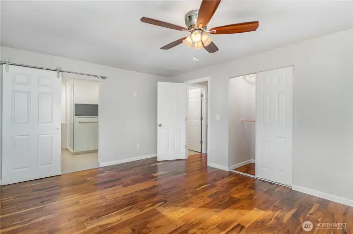 Spacious Primary bedroom offers sizable closet & ceiling fan to stay cool in summer.