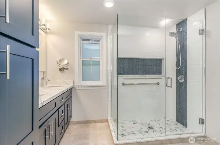 En-suite primary bathroom offers a large walk-in shower.