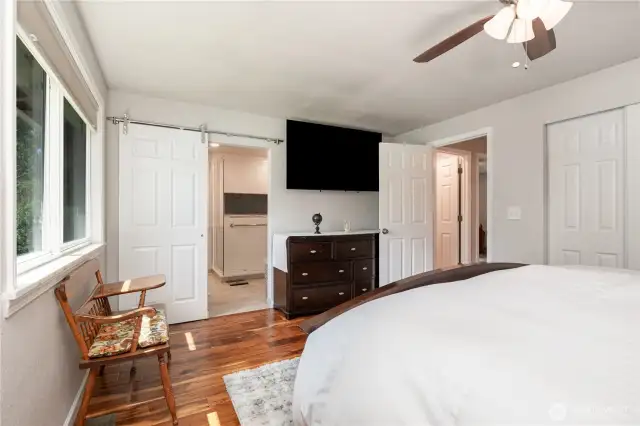 Spacious Primary bedroom offers sizable closet & ceiling fan to stay cool in summer.