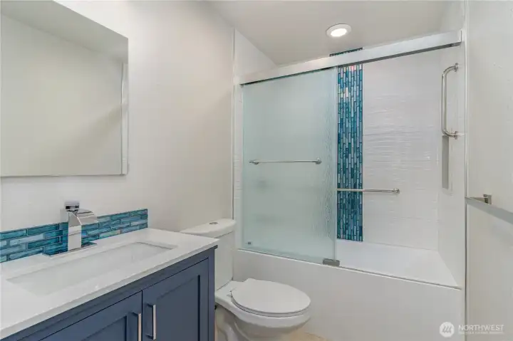 Upstairs full bathroom offers generous space and thoughtful design for a relaxing guest experience.